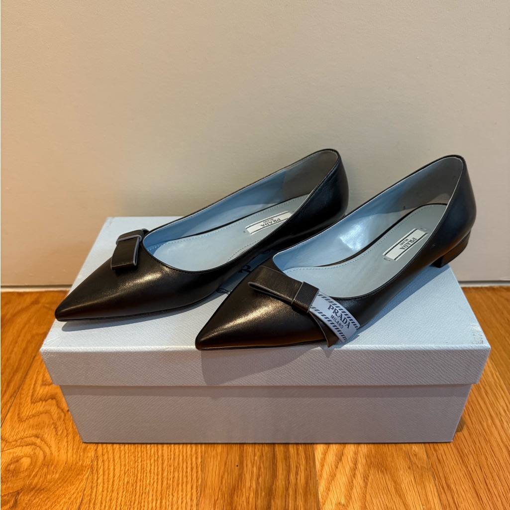 New In Box Prada Black Leather Flats With Blue Prada Logo Ribbon Design
